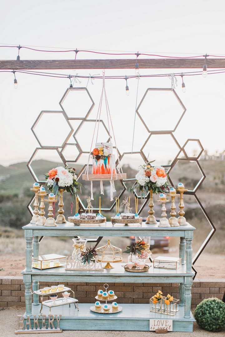 Geometric wedding dessert display overlooking the valley
