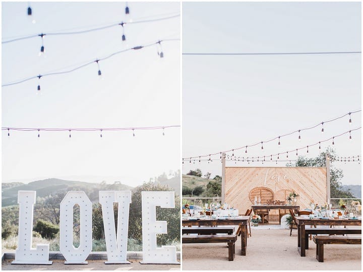 Newlyweds beside a geometric dessert display